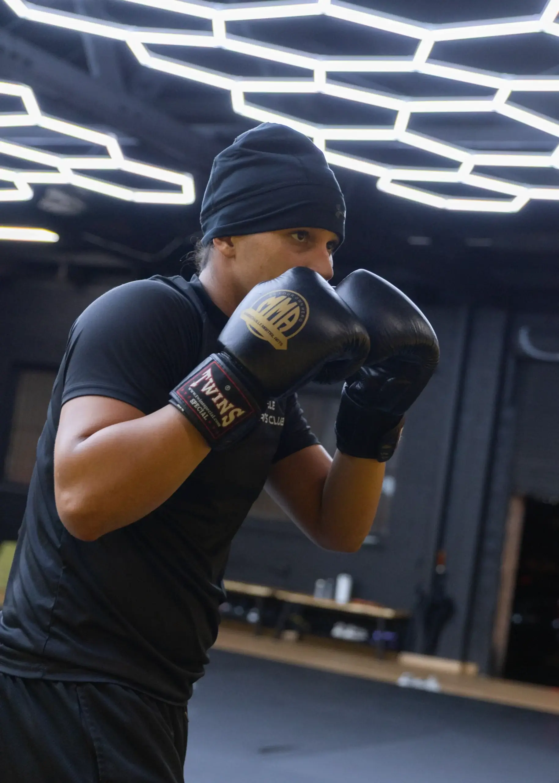 A member shadow boxing on the mats